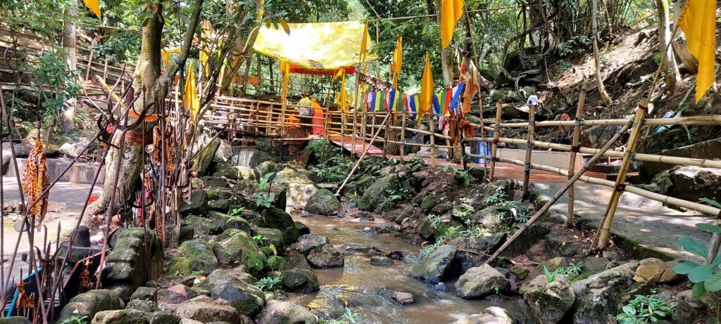 The sacred creek at Bhimashankar Dham, believed to have divine origins, flowing after touching in an eternal embrace.