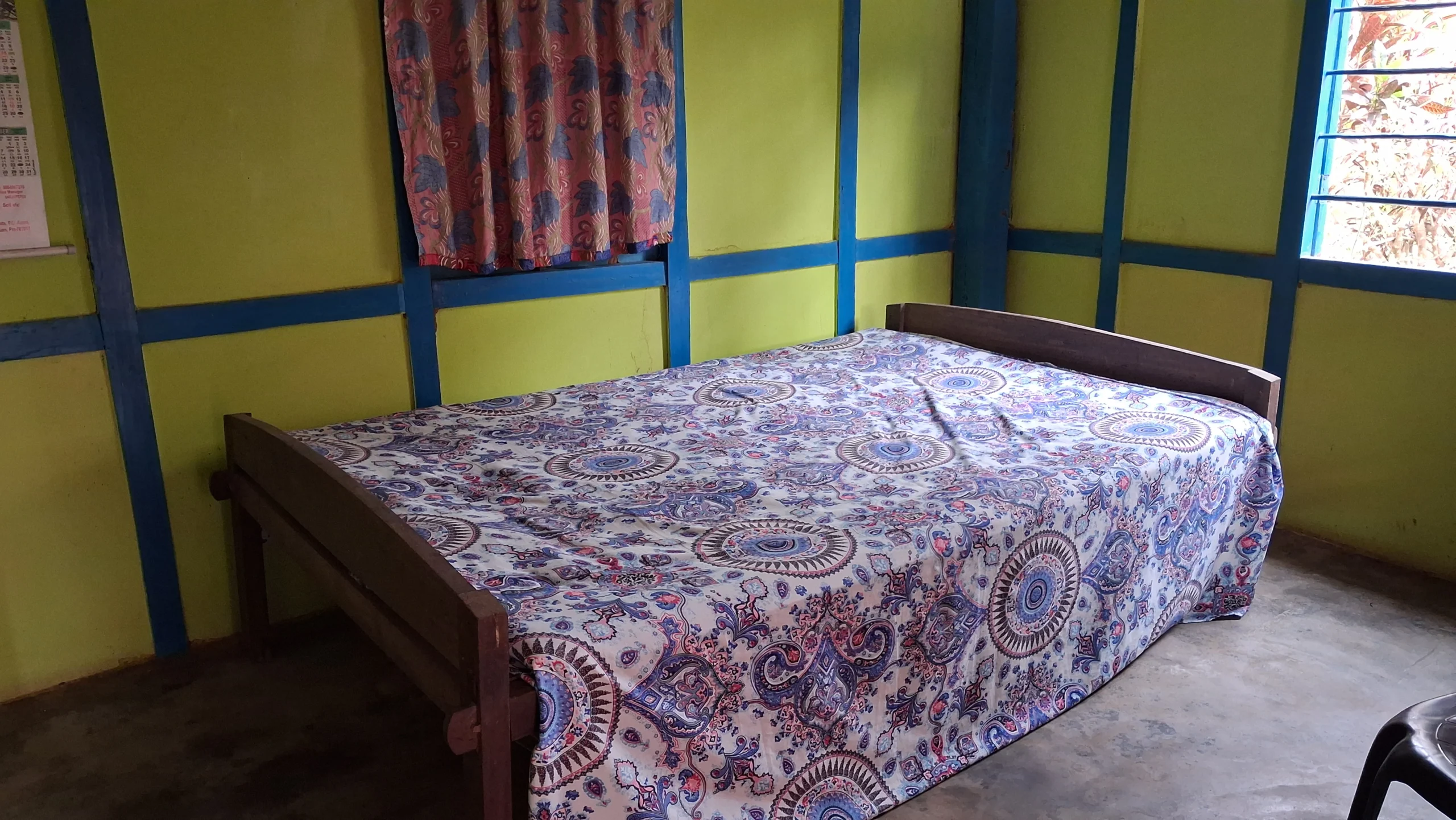 Simple clean bed inside guest room at Nasiriba homestay