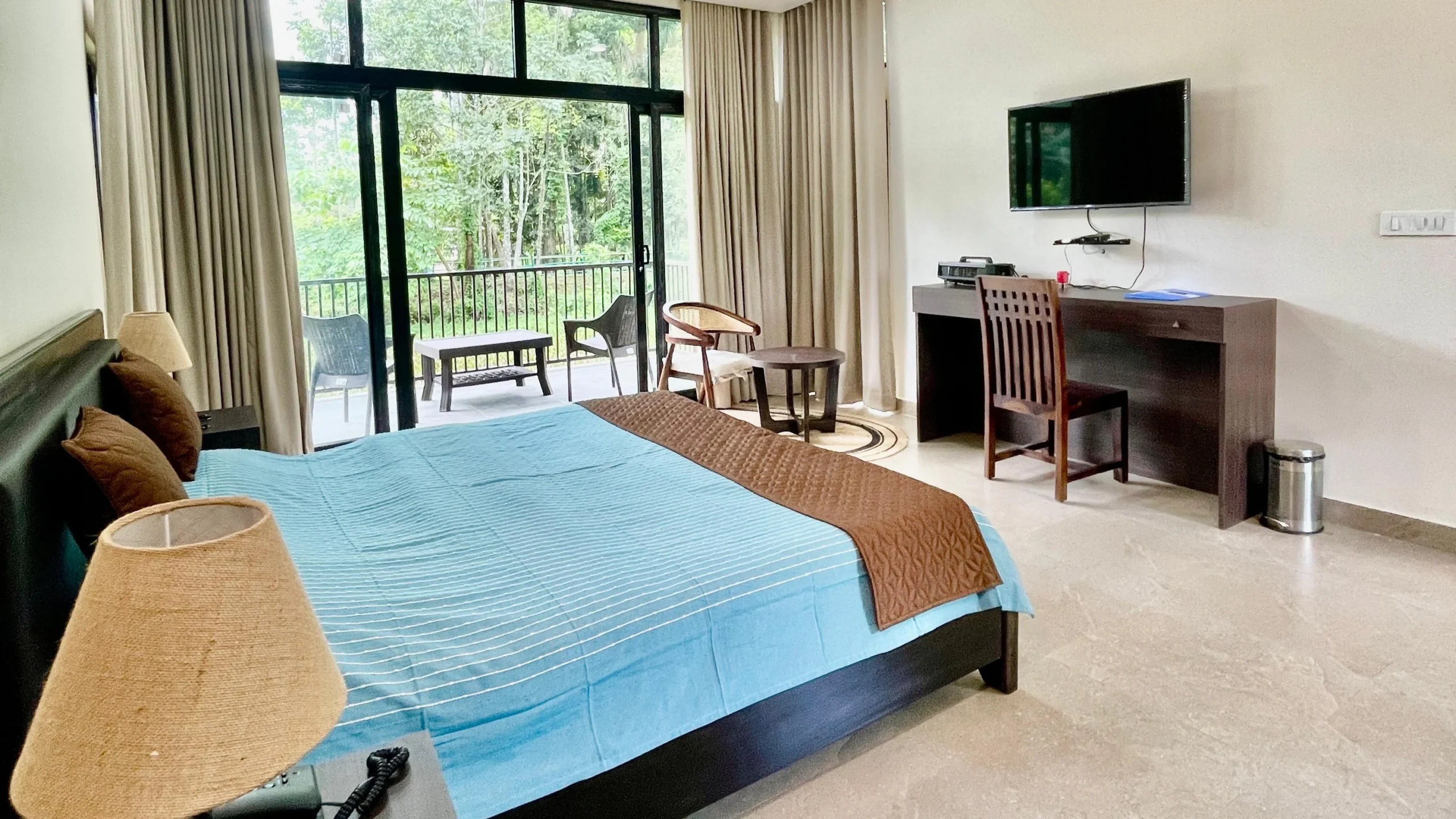 Luxury cottage room with balcony view at Infinity Resorts Kaziranga